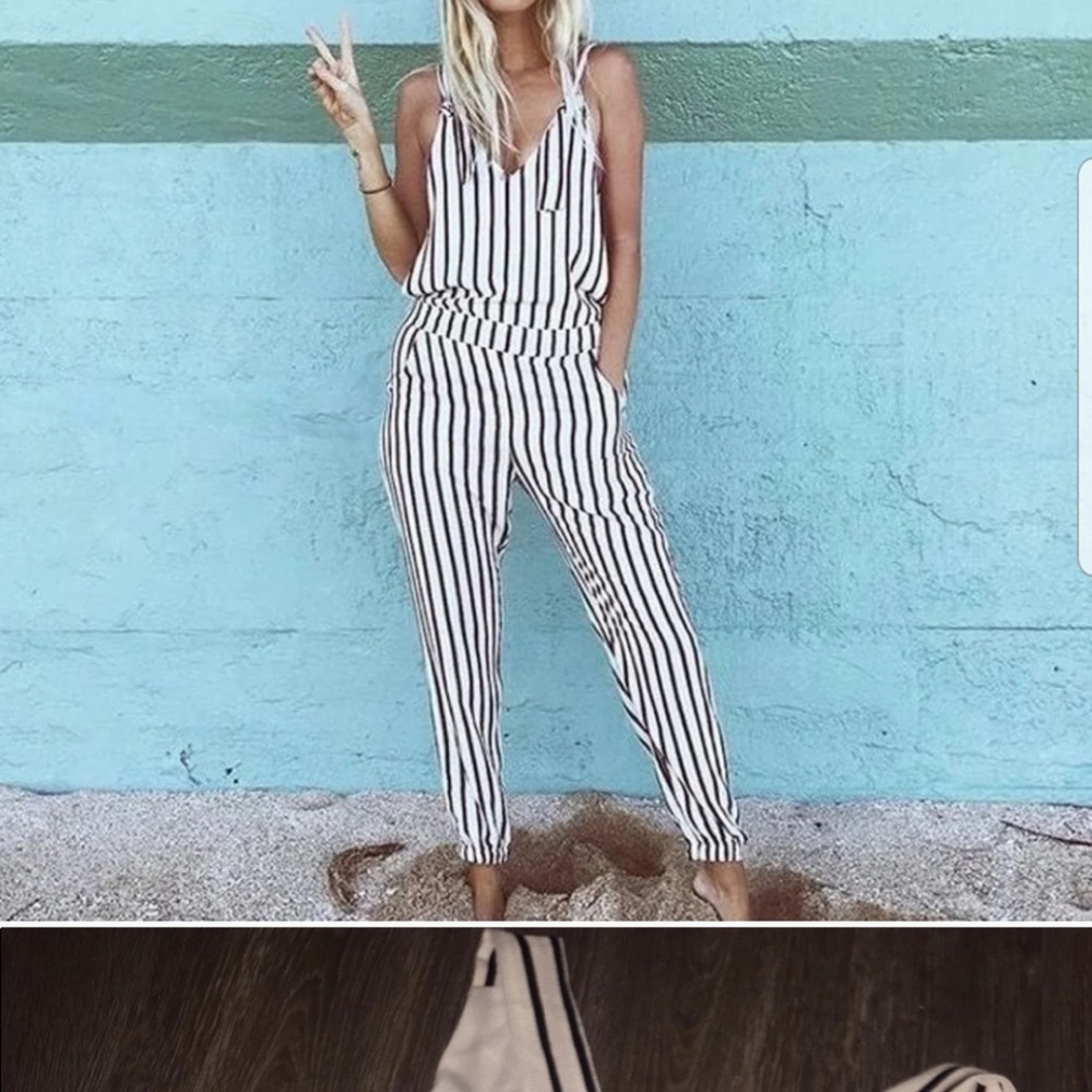 Black and white jumpsuit. Says large but it fits m